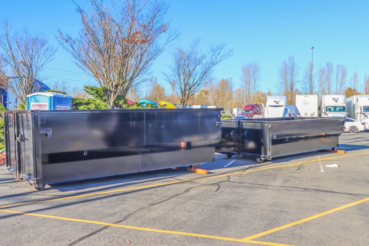 Professional dumpster rental service with roll-off container on residential driveway in Lynwood
